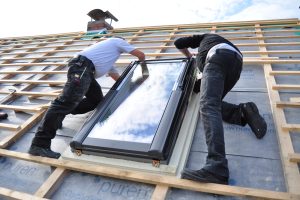 two-men-assembling-a-roof-skylight-window-2023-11-27-05-23-24-utc (2)